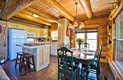 Garfield Cabin | Right on the water, stay at this Instagram photo-ready real LOG CABIN +Kayaks!