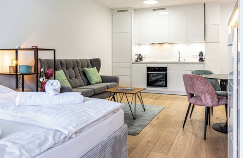 Bodensdorf Apartment | RIOpartment Ossiacher See - Directly on the lake in Bodensdorf, with private bathing area.