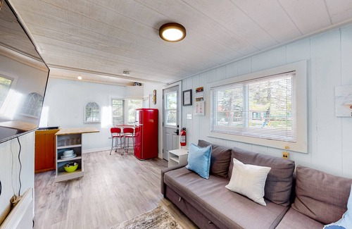 Wasaga Beach Apartment | River View cozy studio cottage with loft, steps shared pool, beach, & firepit