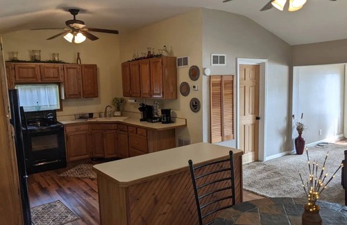Colton Cottage | Riverfront Cottage with Hot Tub, Kayaks, Canoes, & Fishing Boats!