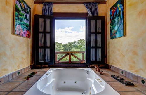 Bullet Tree Falls House | Riverfront Retreat with Balcony, WiFi, Partial AC, Shared Pool