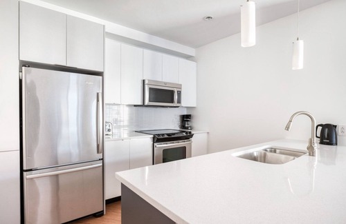 Chinatown Apartment | Roomy Downtown 1BR w/W/D & Gym, nr Greenway, by Blueground