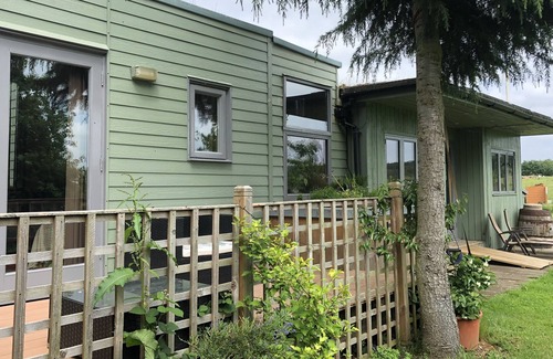 Benson Ski Chalet | Rural self-catering lodge.South-facing sun deck, garden, views over open fields.