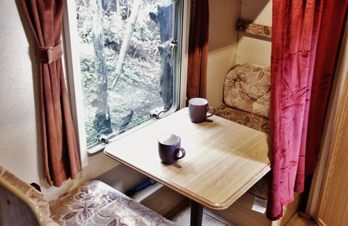 Llanidloes House | Secluded Caravan next to 2 pools & waterfalls. Decking area & Summer house