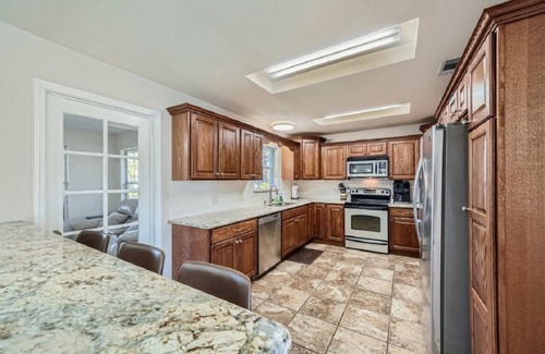 Cedar Creek House | Secluded Country Home on 15 Acres. Pool, BBQ, Hot Tub and Ping Pong. Close to COTA. RV Parking