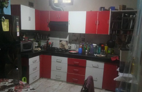 Mehrauli House | semi furnished Flat For Rent with one queen size bed and 4 chairs dining table
