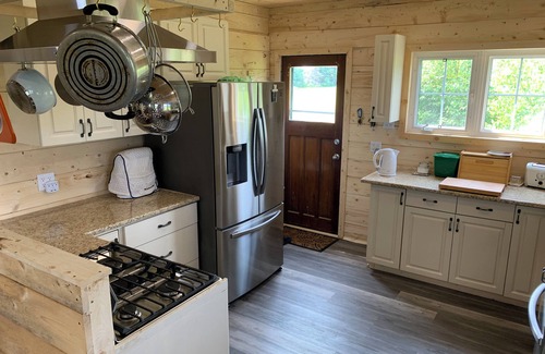 Prince County Cottage | Semi-private beach, huge screened in deck, woods on fenced in property.