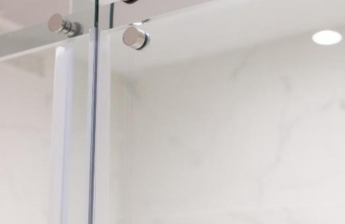 Little Italy Apartment | Serene and Styled Little Italy Studio full bath by Den Stays