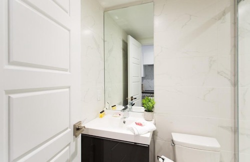 Little Italy Apartment | Serene and Styled Little Italy Studio full bath by Den Stays