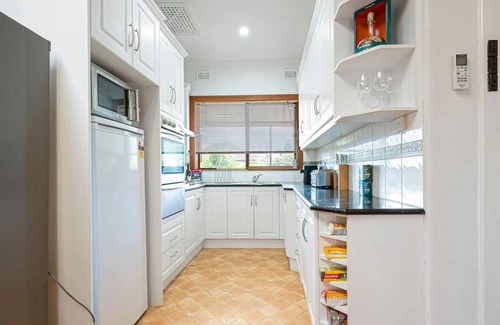 Largs North House | Serenity by the Sea: 4BR Home with beach views