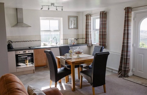 Otley Cottage | Set on a working Dairy farm stunning views, a hot tub and pet freindly