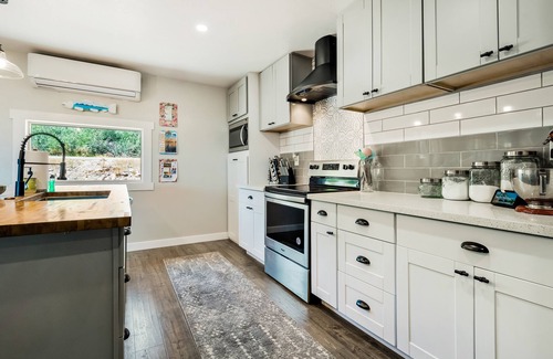 Fish Haven House | Single-level, lakefront getaway with mini-bar, furnished deck & mountain views
