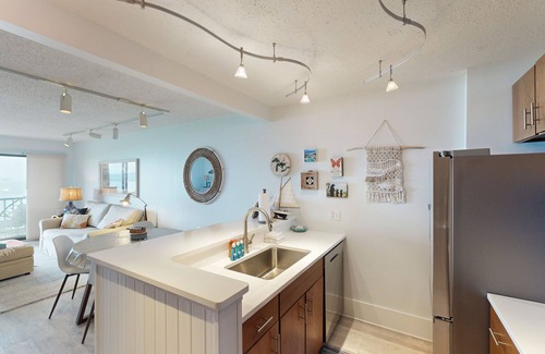 Maple City Condo | Single-level lakefront hideaway with a deck, fireplace, & washer/dryer