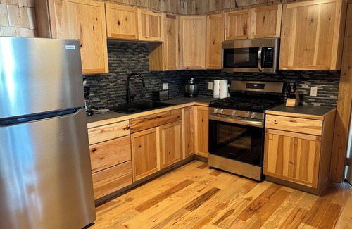 Au Train Cabin | Six bedroom lake front cabin with hot tub and outdoor fire pit