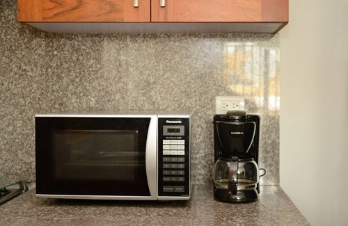 Ensanche Naco Apartment | Sleek,Bright Condo with City-View Terrace –Work & Play in Naco, Santo Domingo!