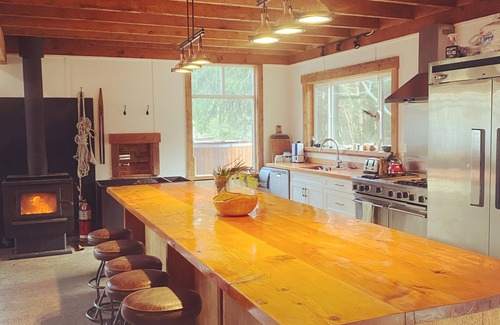 Mansons Landing Ski Chalet | "Sleeps 15: Dog-Friendly Rustic Haven on Cortes Island" Large grass yard