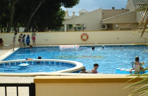 Roda Apartment | Sleeps up to 6, shared pool, parking with Aircon