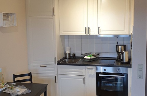 Dornum Apartment | Small apartment in Dornumersiel with glazed balcony House Spieckeroog
