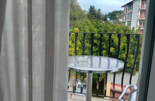 Villagonia Apartment | Sole Mare Giardini Naxos Room 'Girasole' with Balcony, Wi-Fi and Air Conditioning