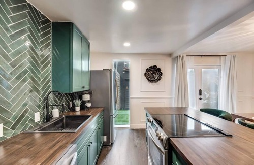 Old East Dallas Condo | Sophisticated 2-Bed, 1.5-Bath furnished condo in central Dallas with a private patio, serene garden views, and exclusive access to an award-winning courtyard equipped with premium wellness products and relaxing lounge areas.