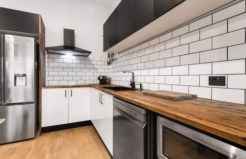 Adelaide Central Business District Apartment | South Terrace · Modern Oasis: Off-Street Parking, Kitchen, WiFi