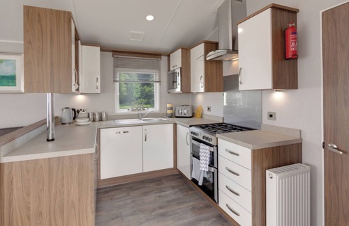 Axminster House | Spacious and luxurious 12ft-wide caravan with one double and two twin.