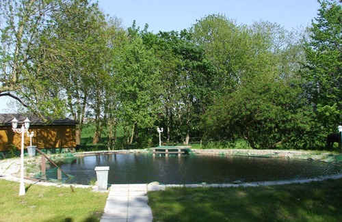 Neudorf House | Spacious exclusive apartment on the 1st floor with a natural pond