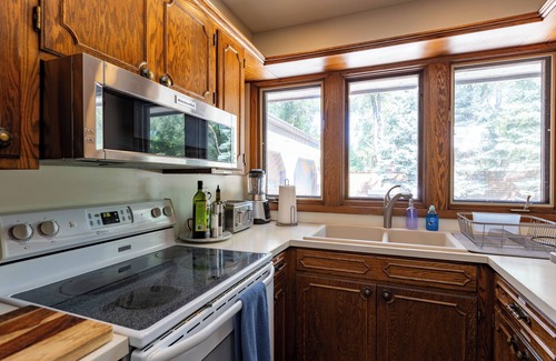 Fridley House | Spacious Mississippi River Retreat-Hot Tub, Massage Chair & Room for 16