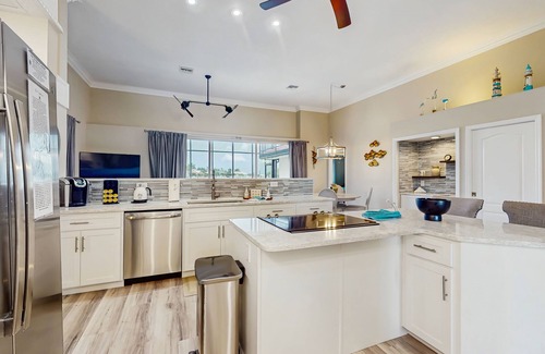 Burnt Store Isles House | Spacious, waterfront home with dock, heated pool, and lanai