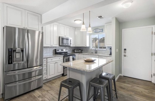 Holiday Isle Condo | SPC 3106 on a canal! Beach service included! Pools, Golf, Pickleball and more!