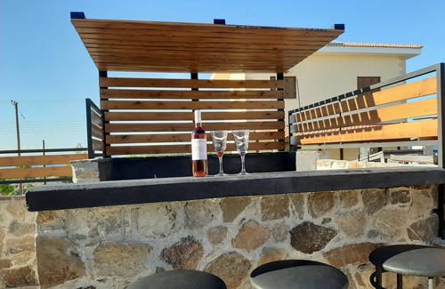 Pentalia House | Special amenities as outdoor hot tub, BBQ and Fireplace.