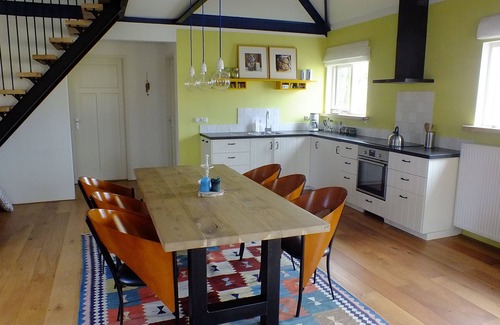 Idsegahuizum House | Special holiday home on the water with its own jetty and boat