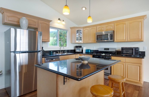 Ninole House | Spectacular two-story ocean-view home on two acres with covered lanai