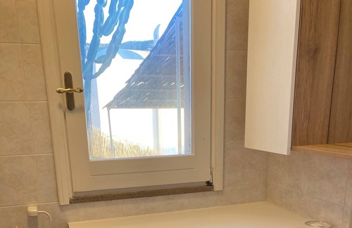 Costa d'Argento Apartment | Stained glass window with panoramic sea view