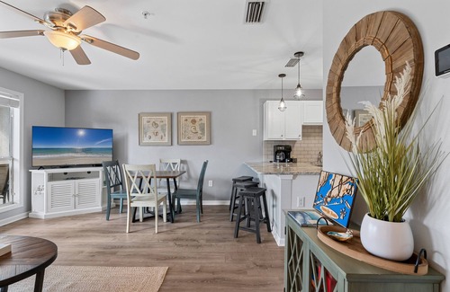 Ono Island Condo | Steps to Pools, Hot Tub, Beach | Poolside Palms | Garden Level Patio & Lawn Area