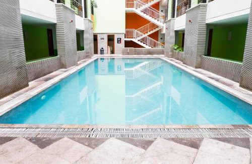 Siwalankerto Apartment | Strategic Studio Apartment at High Point Serviced By Travelio