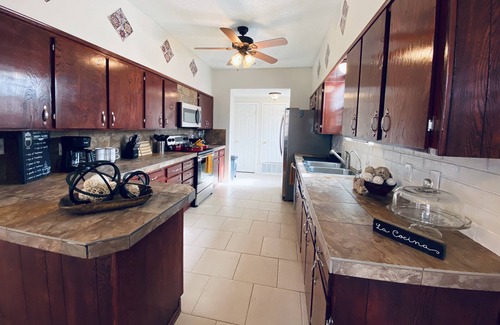 Midland Condo | String light condo with chic brick interior