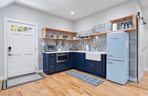Matthews House | Studio above a detached garage away from main house on a private lot.