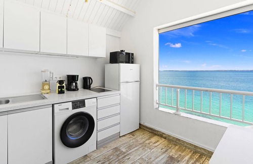 Grand Case Apartment | studio nine feet in the water. New condo feet in water.