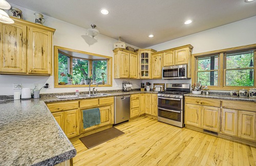 Lake City House | Stunning Riverfront Retreat in Northern Michigan!
