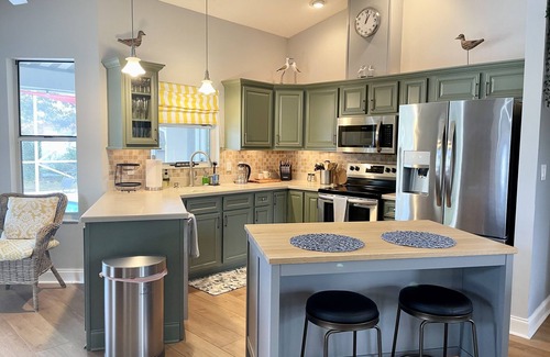 Palm Harbor House | Stylish Family Retreat with Heated Pool, Bikes & More Near Parks & Beaches
