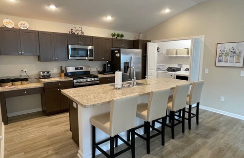 Okahumpka House | Stylish home with gourmet kitchen, dual garages, and private golf cart!