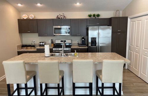 Okahumpka House | Stylish home with gourmet kitchen, dual garages, and private golf cart!