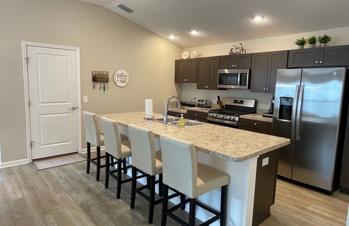 Okahumpka House | Stylish home with gourmet kitchen, dual garages, and private golf cart!