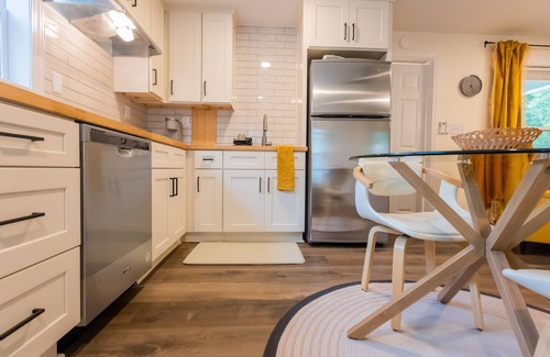 Sunset Road Cottage | Stylish renovated cozy cottage studio in quiet neighborhood 10 minutes to Uptown