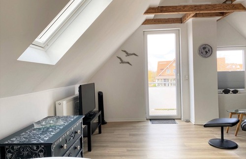 Greetsiel Condo | Stylish, romantic top-floor apartment with balcony and that certain something