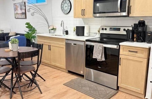 Southwest Calgary House | Stylish suite, family & work friendly, near mountains/parks, free WiFi+parking