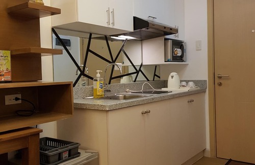 Ususan Condo | Suite Pool View with Balcony