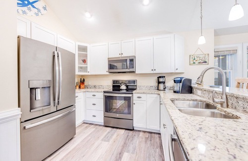 Hatteras Condo | SUMMER SAVINGS - Canalfront Condo w/Private Deck, Resort Pool, and Boat Slips