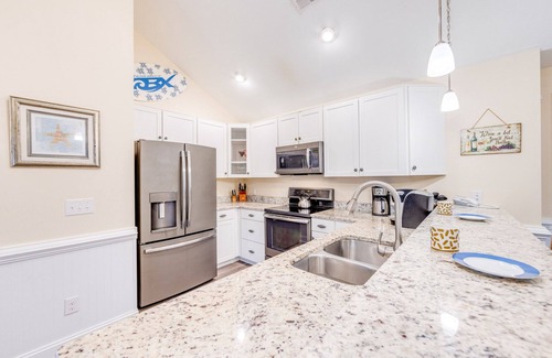 Hatteras Condo | SUMMER SAVINGS - Canalfront Condo w/Private Deck, Resort Pool, and Boat Slips